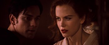 Movie still from “Moulin Rouge!” (2001), directed by Baz Luhrmann – A man and a woman looking at each other; Close Up shot, Over the shoulder angle