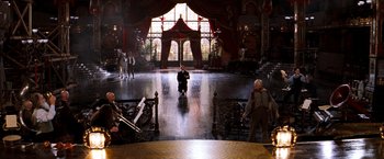 Movie still from “Moulin Rouge!” (2001), directed by Baz Luhrmann – A group of people standing in a large room; Extreme Wide shot, High angle
