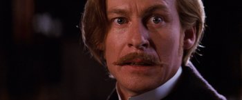 Movie still from “Moulin Rouge!” (2001), directed by Baz Luhrmann – A person with a mustache; Close Up shot, Low angle
