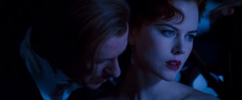 Movie still from “Moulin Rouge!” (2001), directed by Baz Luhrmann – A man and a woman face to face in a dark room; Close Up shot, Over the shoulder angle