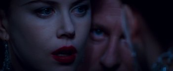 Movie still from “Moulin Rouge!” (2001), directed by Baz Luhrmann – A woman and a man's face; Extreme Close Up shot, Over the shoulder angle