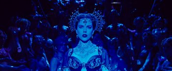 Movie still from “Moulin Rouge!” (2001), directed by Baz Luhrmann – A woman in a blue dress and headpiece; Medium shot, Over the shoulder angle
