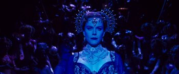 Movie still from “Moulin Rouge!” (2001), directed by Baz Luhrmann – A woman in a blue dress with a crown on her head; Close Up shot, Over the shoulder angle