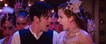 Movie still from “Moulin Rouge!” (2001), directed by Baz Luhrmann – A man and a woman are yelling at each other; Close Up shot, Low angle