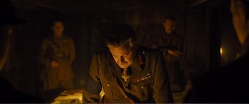 Movie still from “1917” (2019), directed by Sam Mendes – An older man in a military uniform looking down; Medium shot, Low angle