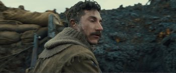 Movie still from “1917” (2019), directed by Sam Mendes – A person wearing a sweater; Close Up shot, Low angle