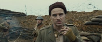 Movie still from “1917” (2019), directed by Sam Mendes – Two men in military uniforms stand next to each other; Close Up shot, Over the shoulder angle