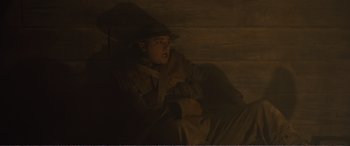 Movie still from “1917” (2019), directed by Sam Mendes – A man wearing a hat and a trench coat; Medium shot, Low angle