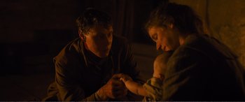 Movie still from “1917” (2019), directed by Sam Mendes – A man and a woman holding hands with a baby; Close Up shot, Over the shoulder angle