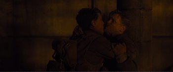 Movie still from “1917” (2019), directed by Sam Mendes – A man and a woman kissing in the dark at night; Close Up shot, Over the shoulder angle
