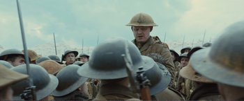 Movie still from “1917” (2019), directed by Sam Mendes – A man in a military uniform is talking to a crowd; Medium shot, Low angle