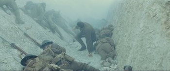 Movie still from “1917” (2019), directed by Sam Mendes – A group of soldiers in the middle of a field; Wide shot, High angle