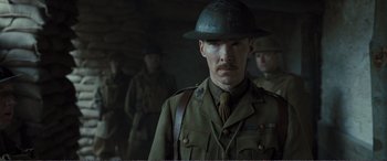 Movie still from “1917” (2019), directed by Sam Mendes – A man in a military uniform and a hat; Close Up shot, Over the shoulder angle