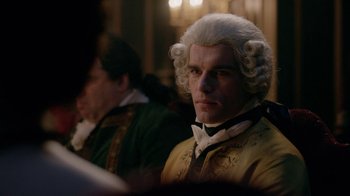 Movie still from “Outlander” (2014), created by Ronald D. Moore – A person wearing a wig; Close Up shot, Over the shoulder angle