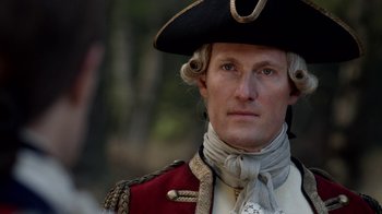 Movie still from “Outlander” (2014), created by Ronald D. Moore – A person wearing a hat; Close Up shot, Over the shoulder angle