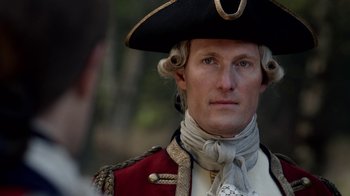 Movie still from “Outlander” (2014), created by Ronald D. Moore – A person wearing a hat; Close Up shot, Over the shoulder angle