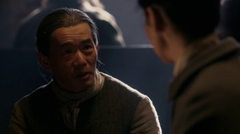 Movie still from “Outlander” (2014), created by Ronald D. Moore – An older man looking at a younger man in a mirror; Close Up shot, Over the shoulder angle