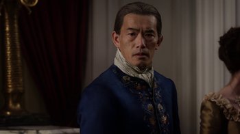 Movie still from “Outlander” (2014), created by Ronald D. Moore – A man in a blue jacket and a white neck tie; Close Up shot, Over the shoulder angle
