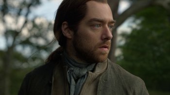Movie still from “Outlander” (2014), created by Ronald D. Moore – A person with long brown hair; Close Up shot, Over the shoulder angle