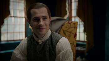 Movie still from “Outlander” (2014), created by Ronald D. Moore – A young man in a victorian era outfit; Close Up shot, Over the shoulder angle