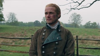 Movie still from “Outlander” (2014), created by Ronald D. Moore – A man with blonde long hair wearing a brown jacket; Close Up shot, Over the shoulder angle