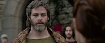 Movie still from “Outlaw King” (2018), directed by David Mackenzie – A man with long hair and a long beard; Close Up shot, Over the shoulder angle