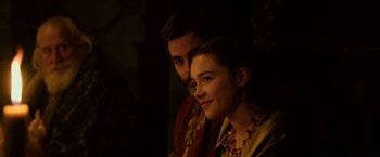 Movie still from “Outlaw King” (2018), directed by David Mackenzie – A man and a woman sitting next to each other; Close Up shot, Over the shoulder angle