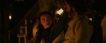 Movie still from “Outlaw King” (2018), directed by David Mackenzie – A man and a woman standing next to each other in the dark; Close Up shot, Over the shoulder angle