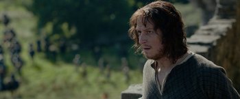 Movie still from “Outlaw King” (2018), directed by David Mackenzie – A person with long hair; Close Up shot, Over the shoulder angle