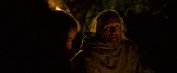 Movie still from “Outlaw King” (2018), directed by David Mackenzie – A man with long hair and a beard is looking at another man with long hair and a beard; Close Up shot, Over the shoulder angle