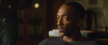 Movie still from “Outside the Wire” (2021), directed by Mikael Håfström – A person sitting in a chair; Close Up shot, Over the shoulder angle