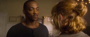 Movie still from “Outside the Wire” (2021), directed by Mikael Håfström – A man and a woman standing next to each other in a room; Close Up shot, Over the shoulder angle