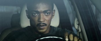 Movie still from “Outside the Wire” (2021), directed by Mikael Håfström – A person in a car; Close Up shot, Over the shoulder angle