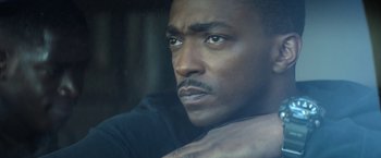 Movie still from “Outside the Wire” (2021), directed by Mikael Håfström – A man's face in a car window; Close Up shot, Low angle