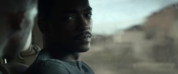 Movie still from “Outside the Wire” (2021), directed by Mikael Håfström – A person looking out of a window; Close Up shot, Over the shoulder angle