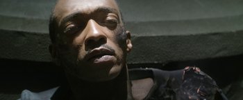 Movie still from “Outside the Wire” (2021), directed by Mikael Håfström – A person with his eyes closed; Extreme Close Up shot, High angle