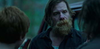 Movie still from “Ozark” (2017), created by Bill Dubuque – A man with long hair and a long beard; Close Up shot, Over the shoulder angle