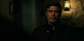 Movie still from “Ozark” (2017), created by Bill Dubuque – A person wearing a black jacket; Close Up shot, Over the shoulder angle