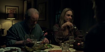 Movie still from “Ozark” (2017), created by Bill Dubuque – A man and a woman sitting at a dinner table; Medium shot, Over the shoulder angle