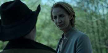 Movie still from “Ozark” (2017), created by Bill Dubuque – A woman in a gray jacket is talking to a man; Close Up shot, Over the shoulder angle