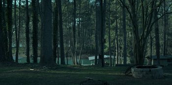 Movie still from “Ozark” (2017), created by Bill Dubuque – A forest with a boat in the middle of the trees; Extreme Wide shot, High angle