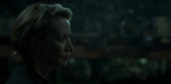 Movie still from “Ozark” (2017), created by Bill Dubuque – A woman with short blonde hair looking to her left; Close Up shot, Over the shoulder angle