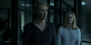 Movie still from “Ozark” (2017), created by Bill Dubuque – Two women standing next to each other in front of a building; Medium shot, Low angle