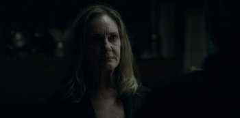 Movie still from “Ozark” (2017), created by Bill Dubuque – A person in a dark room; Close Up shot, Over the shoulder angle