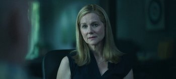 Movie still from “Ozark” (2017), created by Bill Dubuque – A person sitting in a chair; Close Up shot, Over the shoulder angle