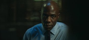 Movie still from “Ozark” (2017), created by Bill Dubuque – A person wearing a shirt and tie; Close Up shot, Low angle
