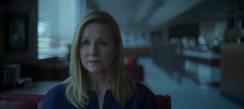Movie still from “Ozark” (2017), created by Bill Dubuque – A person sitting in a chair; Close Up shot, Over the shoulder angle