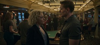 Movie still from “Ozark” (2017), created by Bill Dubuque – A man and a woman standing next to each other in a room; Medium shot, Over the shoulder angle