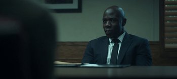 Movie still from “Ozark” (2017), created by Bill Dubuque – A man sitting at a table; Close Up shot, Over the shoulder angle