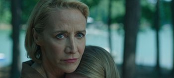 Movie still from “Ozark” (2017), created by Bill Dubuque – A person holding a child; Close Up shot, Over the shoulder angle